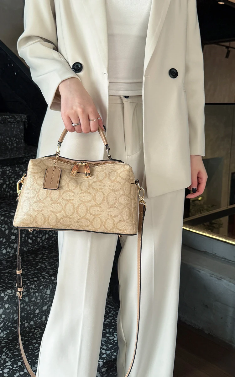Monogram Boston Bag, by the handle